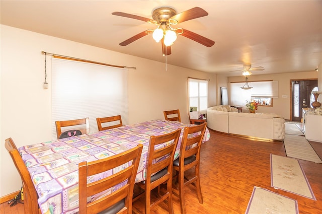 dining space featuring hardwood / wood-style flooring and ceiling fan