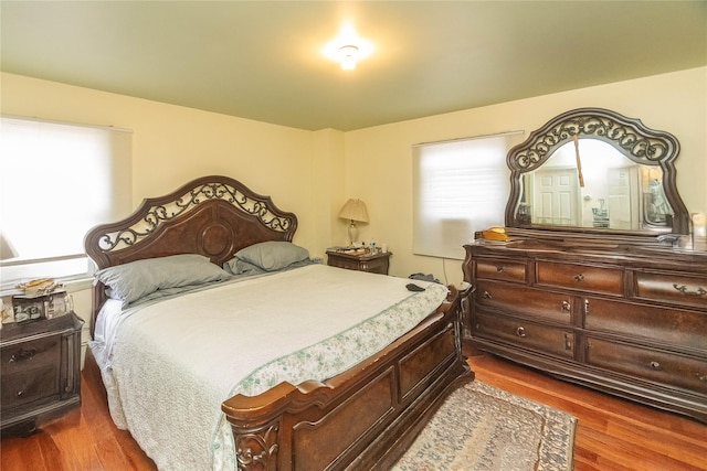 bedroom with wood-type flooring