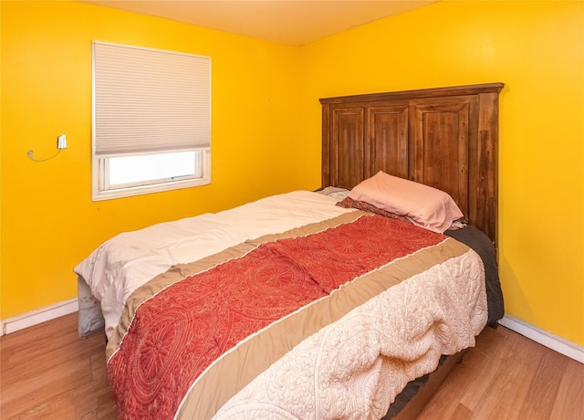 bedroom featuring hardwood / wood-style floors