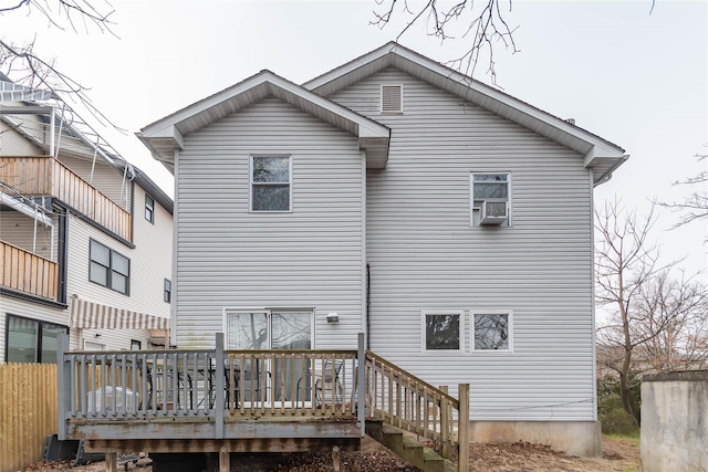 back of property featuring a wooden deck