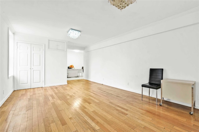 interior space with hardwood / wood-style flooring and crown molding