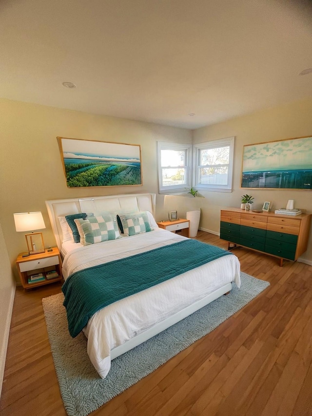 bedroom featuring wood-type flooring