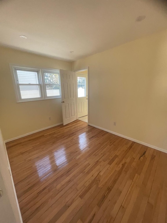 unfurnished room featuring light wood-type flooring