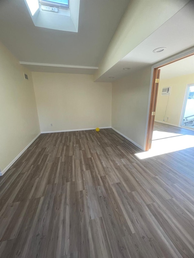 unfurnished living room with dark hardwood / wood-style flooring and vaulted ceiling