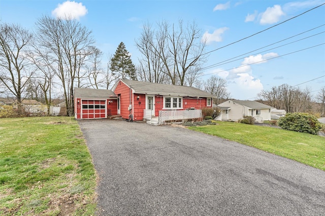 ranch-style home with a front yard and a garage