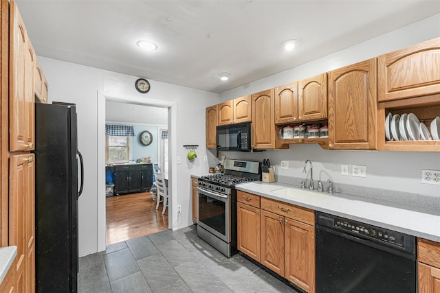 kitchen featuring sink and black appliances