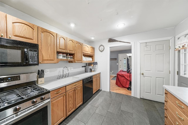 kitchen featuring sink and black appliances