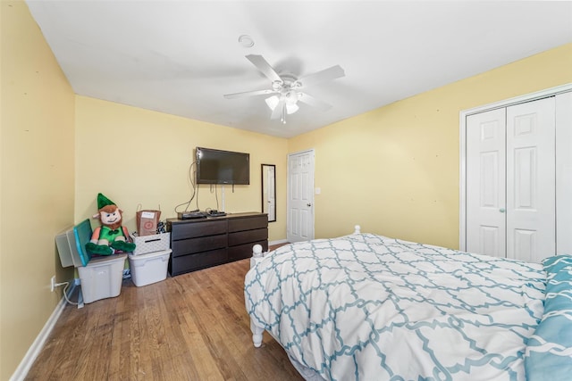 bedroom featuring ceiling fan and hardwood / wood-style floors