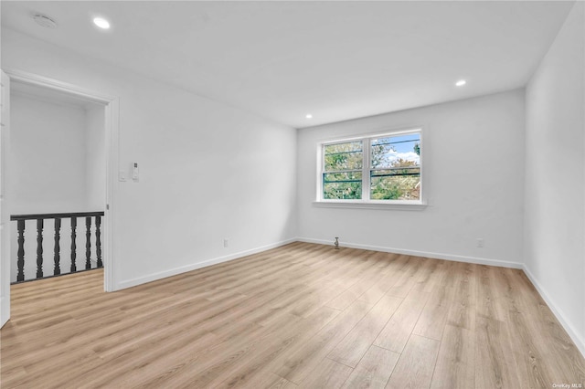 unfurnished room featuring light hardwood / wood-style floors