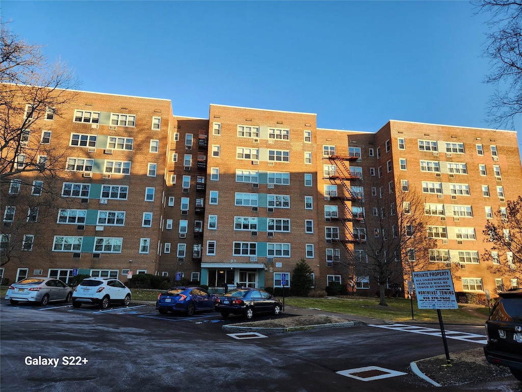 view of property with uncovered parking