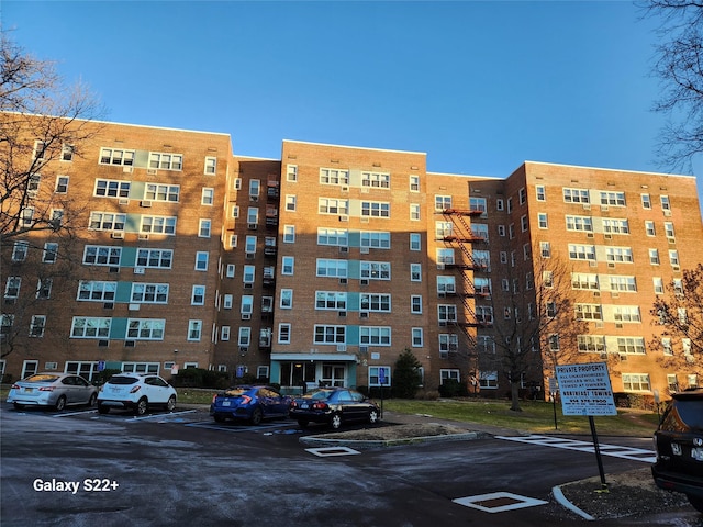 view of property with uncovered parking