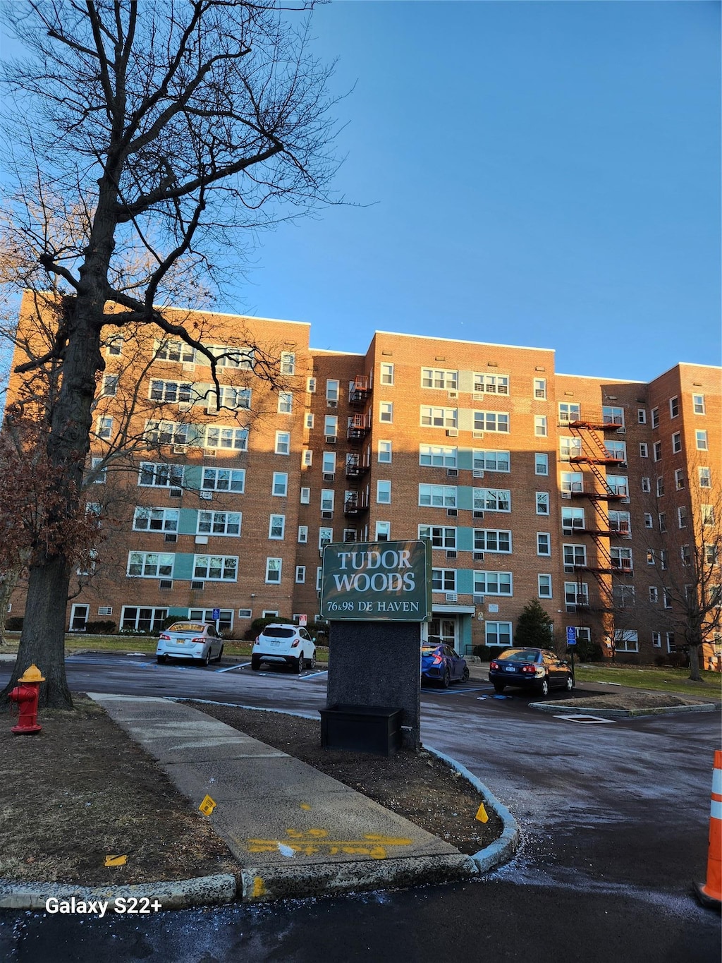 view of building exterior featuring uncovered parking