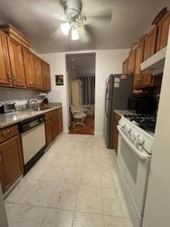 kitchen featuring white appliances, a ceiling fan, a sink, and brown cabinetry
