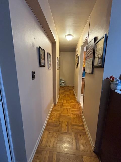 corridor featuring baseboards