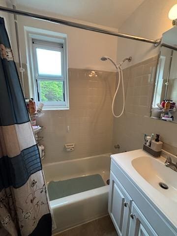 bathroom featuring vanity and shower / bath combo with shower curtain