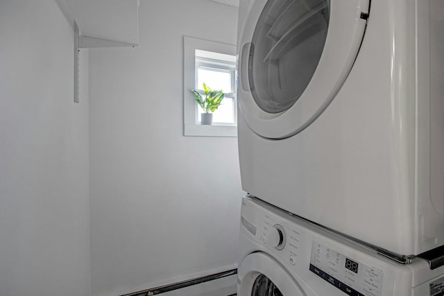 laundry room featuring stacked washer / dryer