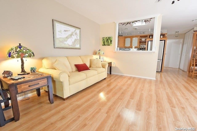 living room with light hardwood / wood-style flooring