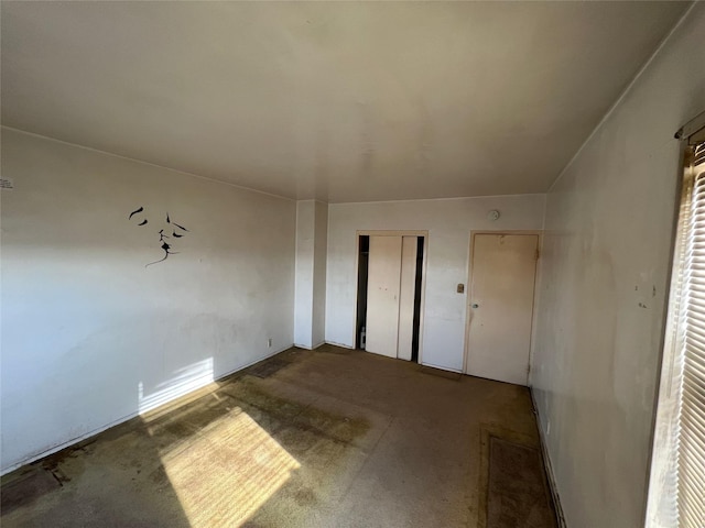 unfurnished room featuring carpet floors