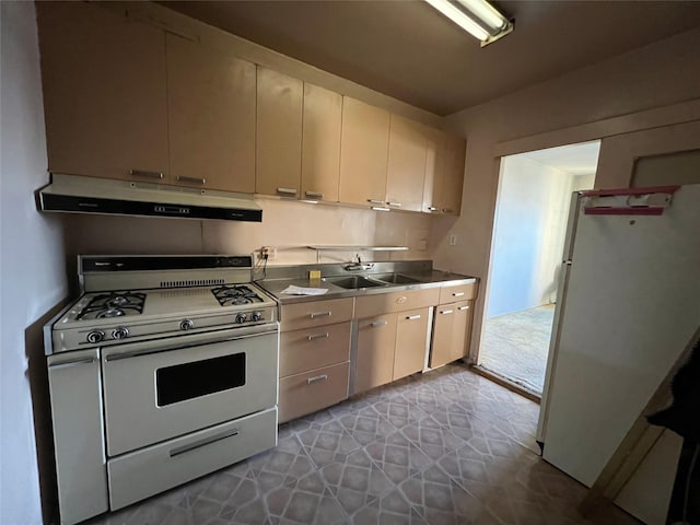 kitchen featuring white appliances and sink