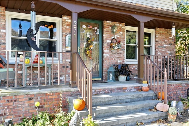 entrance to property featuring a porch