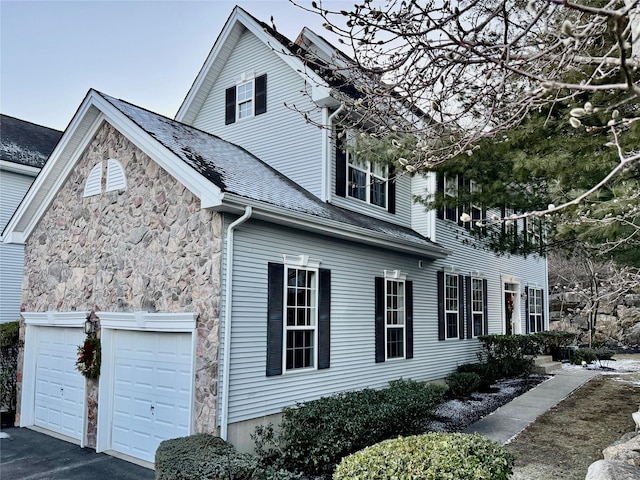 view of property exterior with a garage