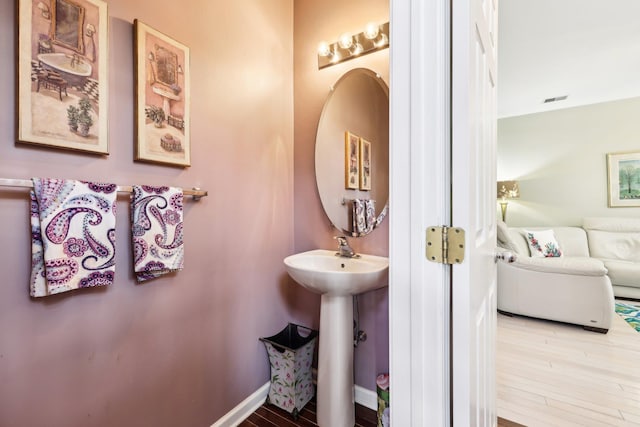 bathroom featuring hardwood / wood-style flooring