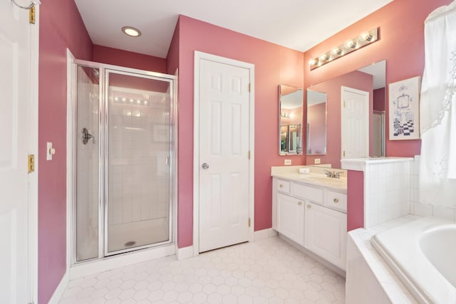 bathroom with separate shower and tub, vanity, and tile patterned floors