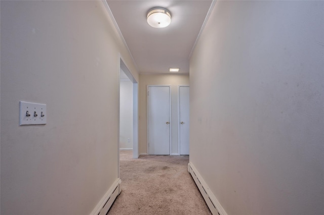 corridor with light carpet, baseboard heating, and ornamental molding