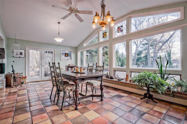 dining room with lofted ceiling, french doors, ceiling fan with notable chandelier, and a baseboard radiator