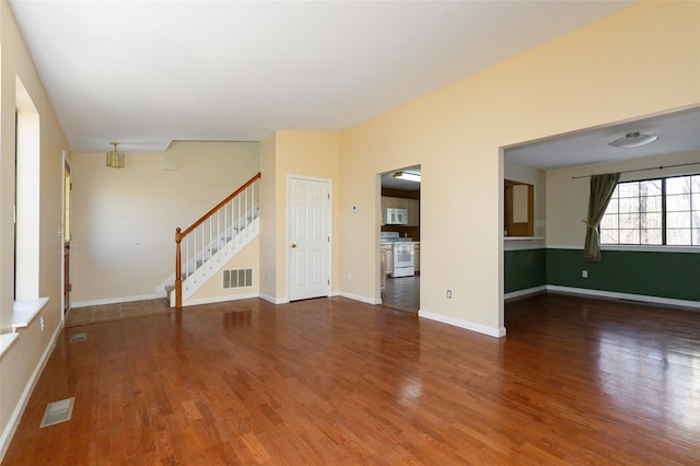 unfurnished living room featuring wood-type flooring