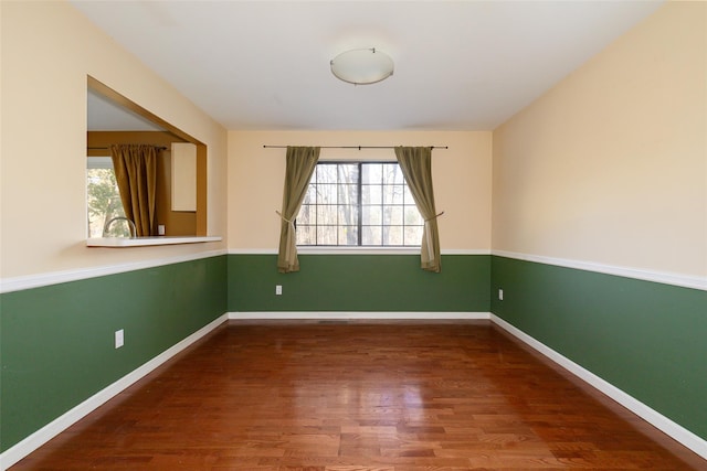 empty room with wood-type flooring