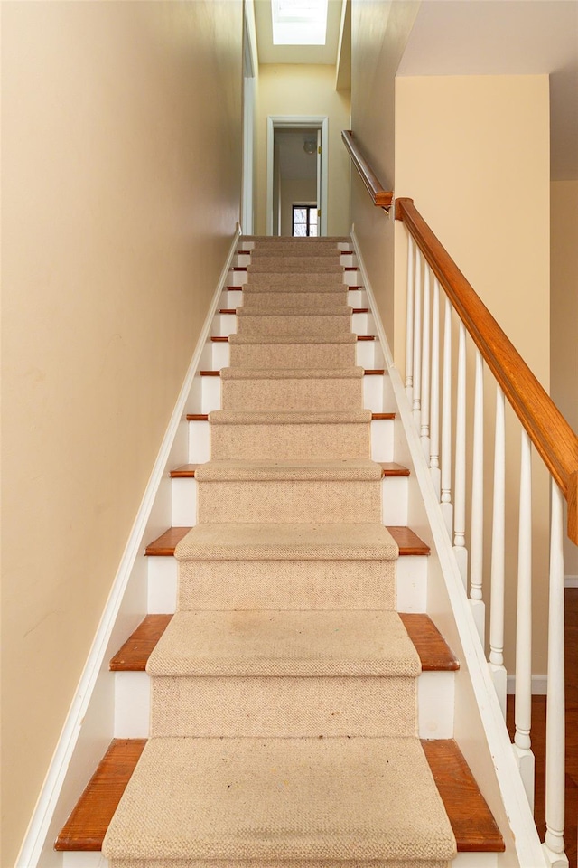 stairway with a skylight