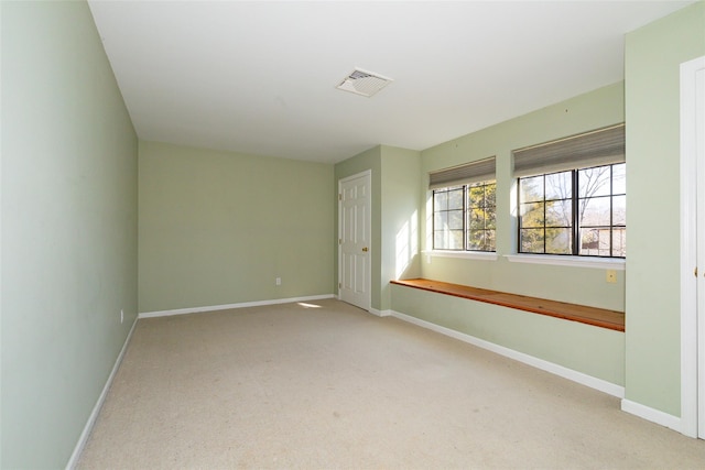 empty room featuring light carpet