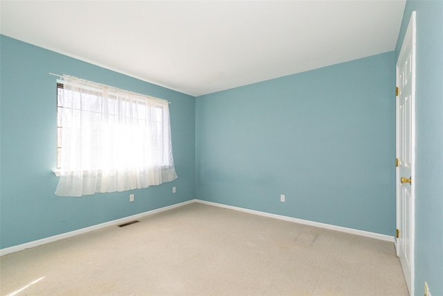 unfurnished room with carpet flooring