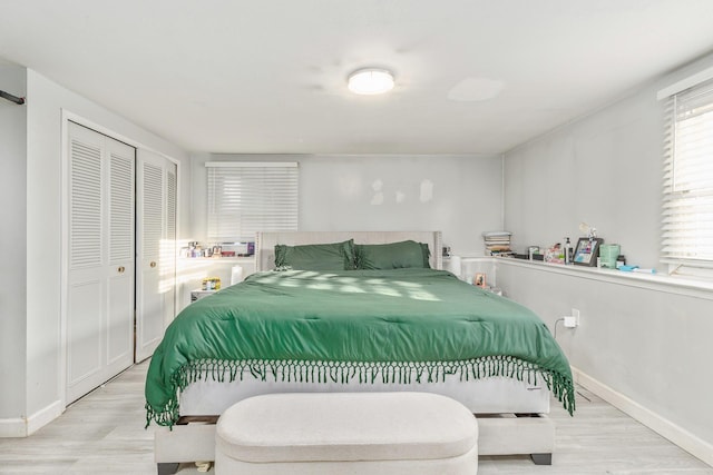 bedroom featuring light hardwood / wood-style floors and a closet