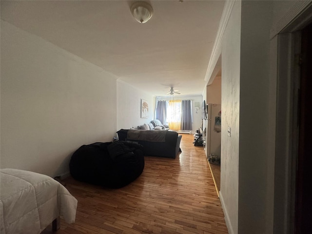 bedroom featuring crown molding and hardwood / wood-style floors