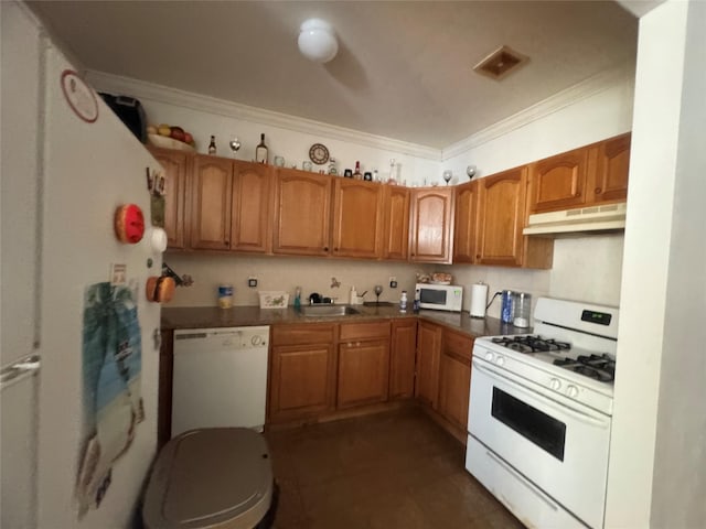 kitchen with sink, white appliances, and ornamental molding