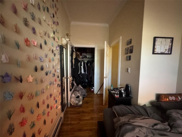 hall featuring baseboard heating, crown molding, and dark hardwood / wood-style floors