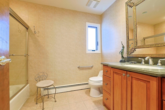 full bathroom with toilet, tile walls, a baseboard radiator, enclosed tub / shower combo, and tile patterned flooring