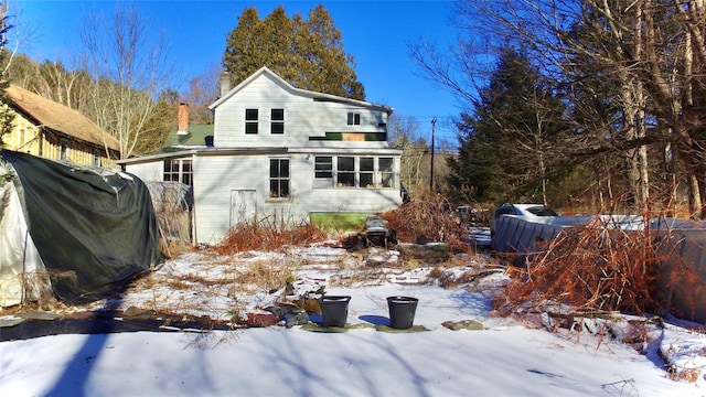 view of snow covered house