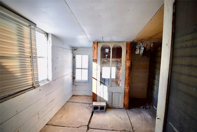 miscellaneous room with wooden walls