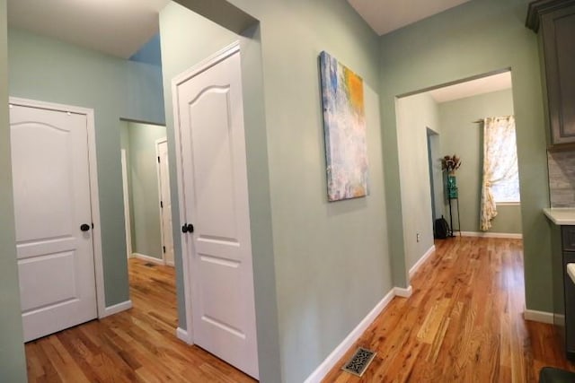 hall with light hardwood / wood-style floors