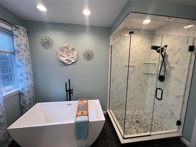 bathroom featuring sink and shower with separate bathtub