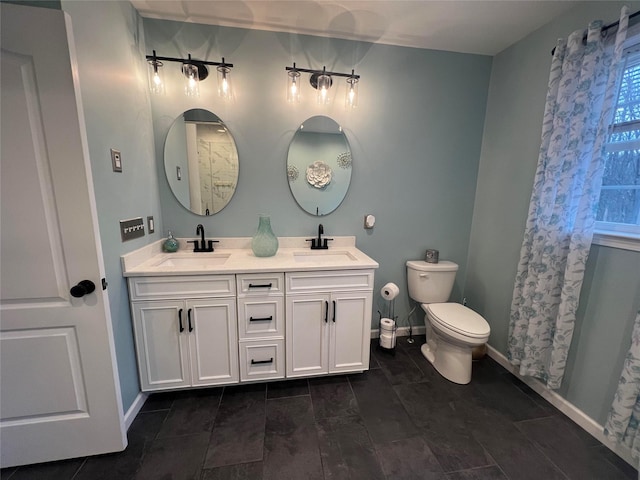 bathroom featuring toilet and vanity