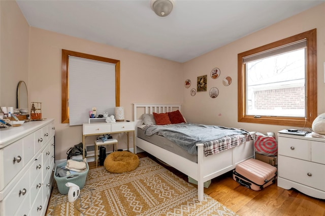 bedroom featuring light wood-type flooring