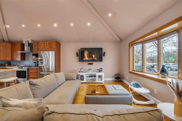 living room with lofted ceiling and light hardwood / wood-style floors