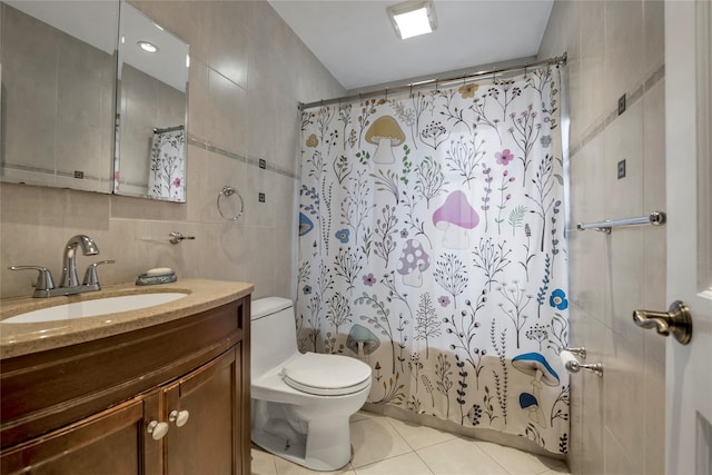 full bathroom featuring tile patterned floors, vanity, shower / tub combo, tile walls, and toilet