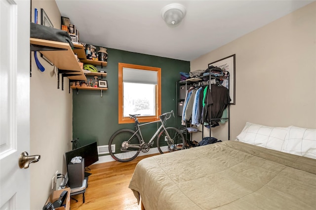 bedroom with wood-type flooring