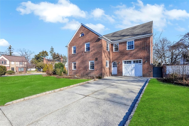 view of front facade with a front lawn and a garage