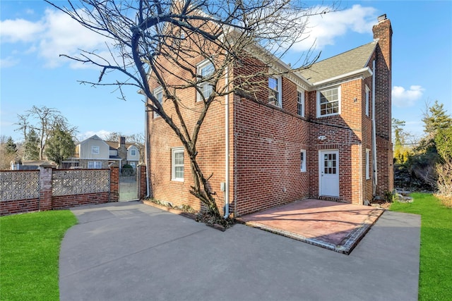 rear view of property featuring a patio